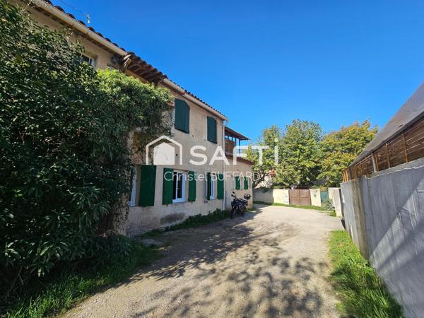 Petit immeuble à fort potentiel avec terrain constructible