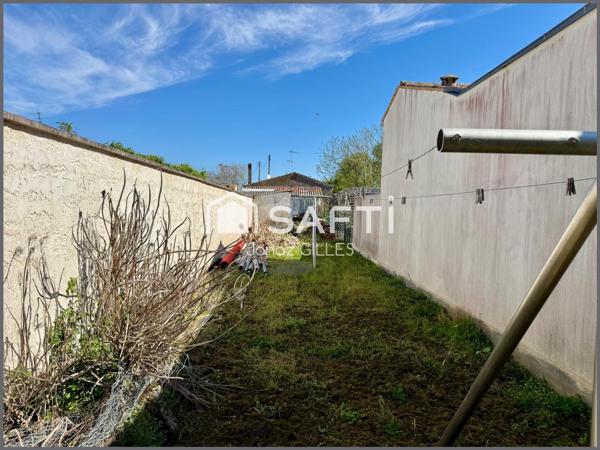 Terrain à bâtir avec bâtiment existant