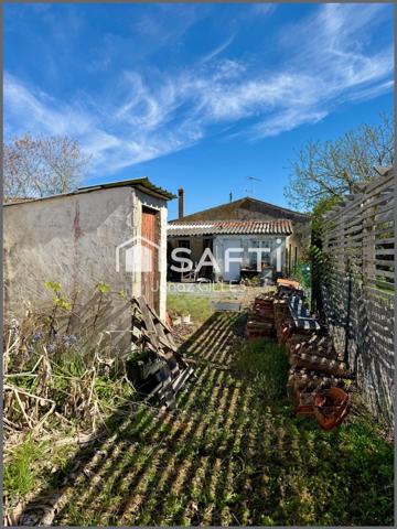 Terrain à bâtir avec bâtiment existant