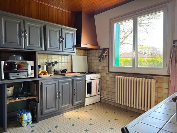 Maison de plain-pied 105 m² + double garage – env. 155 m² utiles – terrain 1 533 m² – proche commodités
