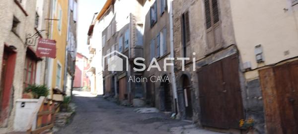 Appartement de 86m² tranversant avec terrasse, local commercial, grenier