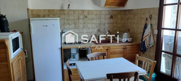 Appartement de 86m² tranversant avec terrasse, local commercial, grenier