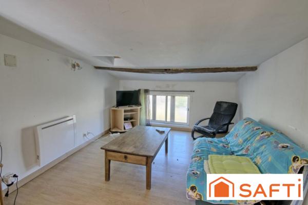 Immeuble pour investisseur ou projet commercial 290 m² comprenant 1 habitation et une surface commerciale.