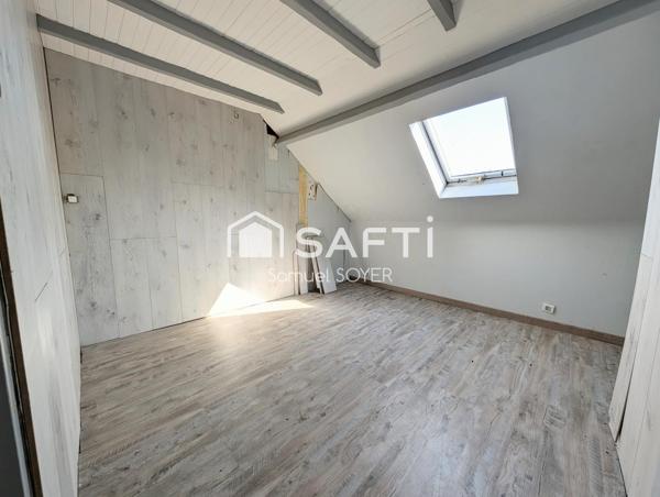 MAISON SEMI-MITOYENNE AVEC JARDIN