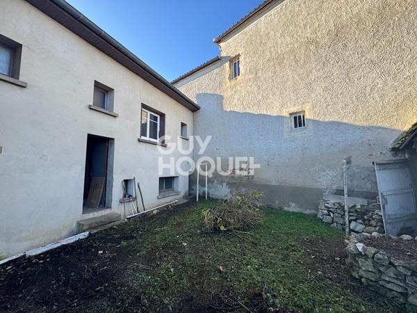 Maison de village avec garage et jardin