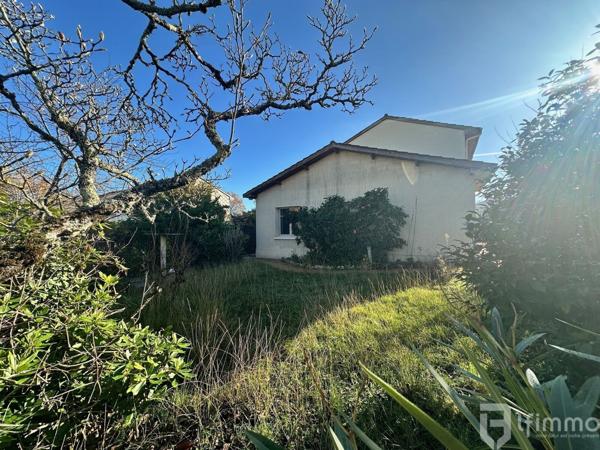 Maison avec garage et jardin au calme