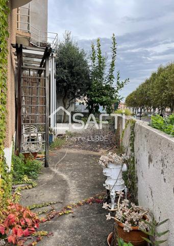Maison de ville à rénover avec garage et terrasse