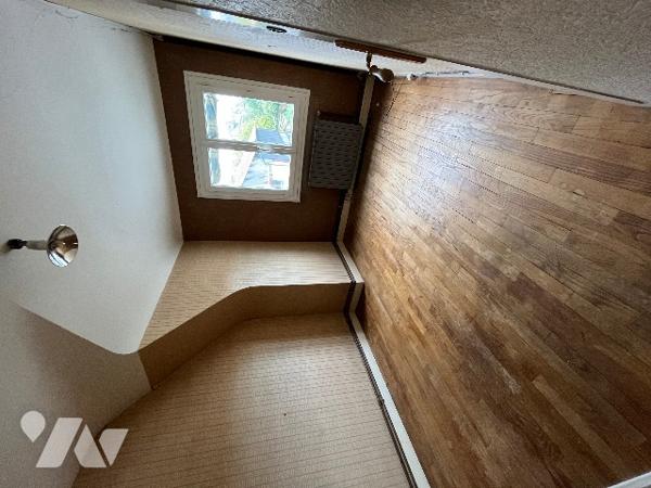 Maison d’habitation située en centre ville, avec salle, cuisine, 3 chambres, salle d'eau, garage.