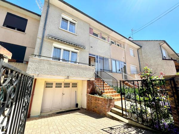 Maison mitoyenne avec terrasse et jardin