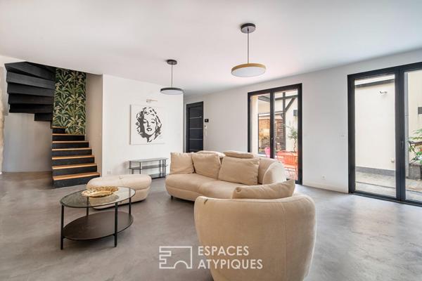 Deux maisons communicantes et un deux-pièces autour d’une cour privée