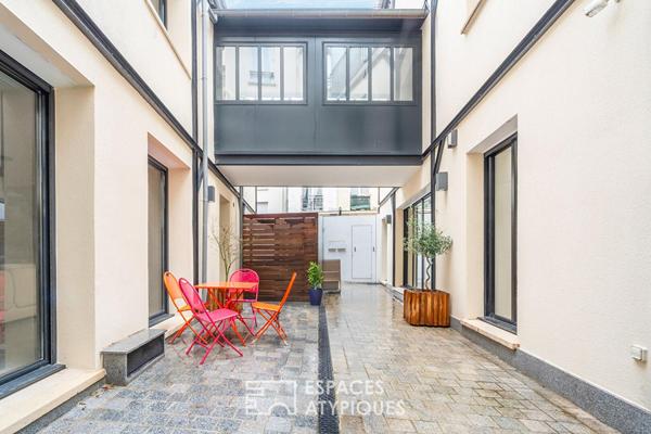 Deux maisons communicantes et un deux-pièces autour d’une cour privée