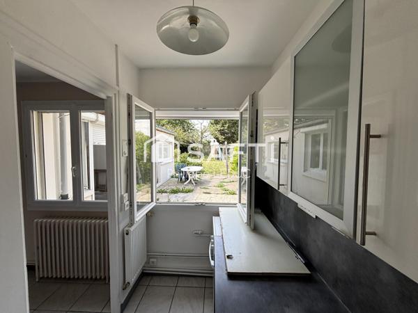 Maison semi mitoyenne avec garage - Beaux volumes !