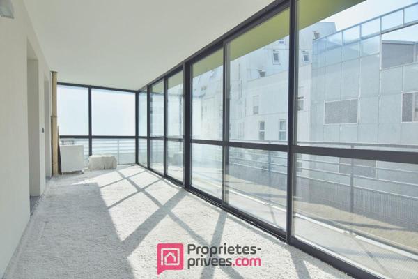 Appartement  3 pièces 66,03 m² Carrez  avec 18 m² de jardin d'hiver et 8 m² de balcon filant