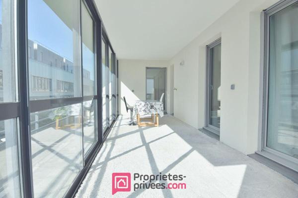 Appartement  3 pièces 66,03 m² Carrez  avec 18 m² de jardin d'hiver et 8 m² de balcon filant