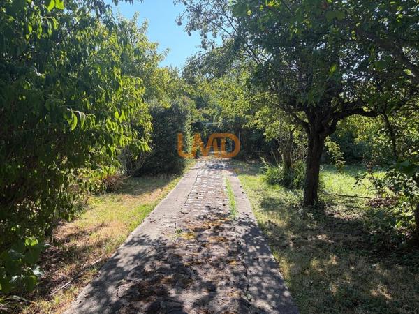 Propriété familiale rare avec parc arboré et fort potentiel foncier