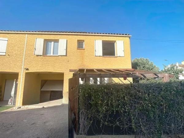 Maison de type 4 avec garage et jardin