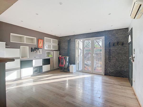 Maison de type 4 avec garage et jardin