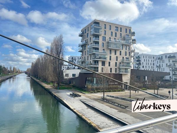 Appartement F3 avec vue sur le canal, immeuble récent avec loggia, cave et parking à Bobigny 93000