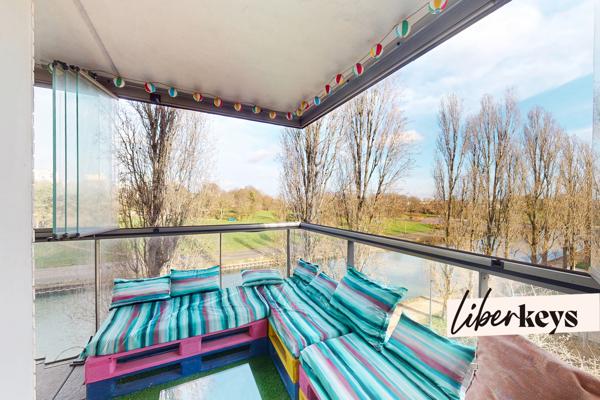 Appartement F3 avec vue sur le canal, immeuble récent avec loggia, cave et parking à Bobigny 93000