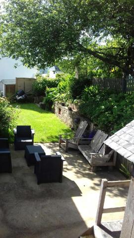 Maison chaleureuse de 98.74 M2 dotée de 4 chambres  avec terrain arboré et structuré avec terrasse exposition Sud-Ouest