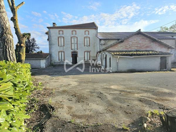 Maison de caractère avec dépendances et garages