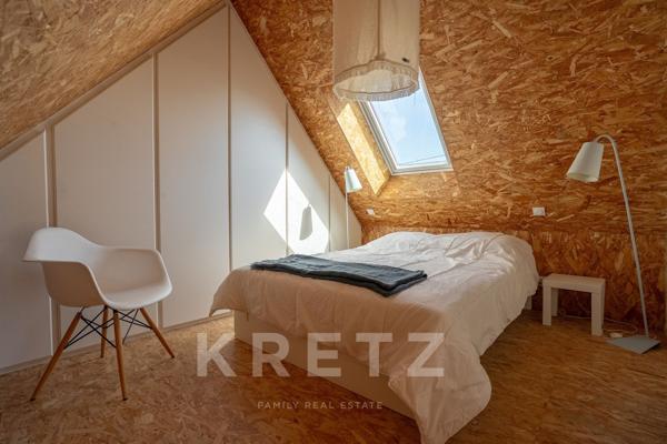 Maison ossature bois à pied des plages