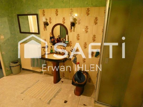 Appartement , 115 m²,5 pièces,4 chambres,salon cuisine,garage, dépendances et jardin.