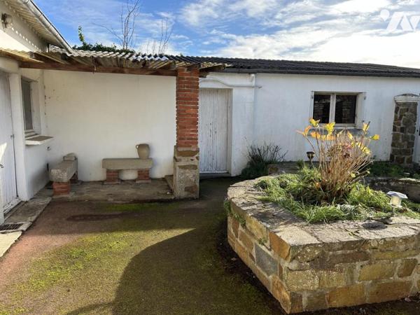 Maison ancienne en pierre au coeur du bourg