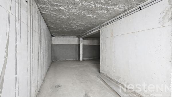 Place de stationnement en sous sol dans une résidence sécurisée