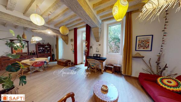 Maison de ville avec jardin et place de parking couverte