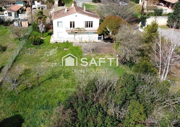 Maison T6 d'environ 113m² avec grand garage de 65m² sur une parcelle de 1374m²