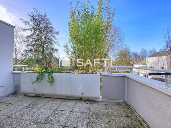 Appartement 3 pièces avec terrasse, garage et places de parking