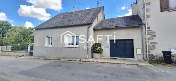 Maison avec garage et jardin à fort potentiel