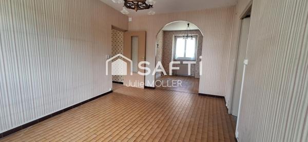 Maison avec garage et jardin à fort potentiel