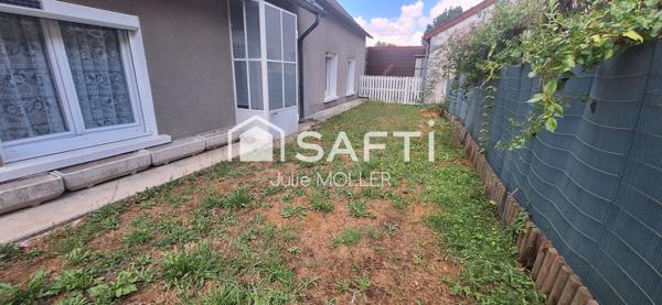 Maison avec garage et jardin à fort potentiel
