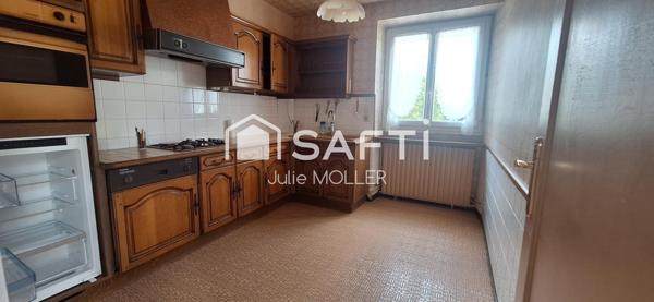 Maison avec garage et jardin à fort potentiel