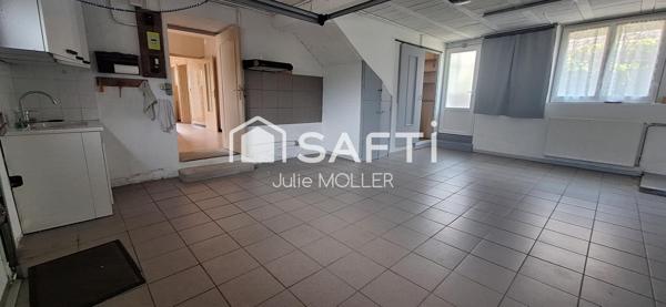 Maison avec garage et jardin à fort potentiel