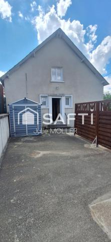 Maison avec garage et jardin à fort potentiel