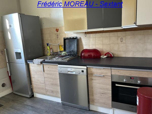 Immeuble en plein centre ville avec local commercial et appartement T2 + Jardin au calme