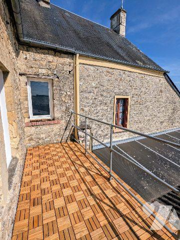 Immeuble comprenant deux appartements dont un loué