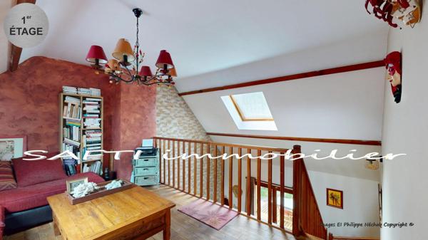 Maison individuelle non mitoyenne de 115m2 habitables - 3/4 chambres - sous-sol total sur 1446m2 de terrain entièrement arboré et paysagé .