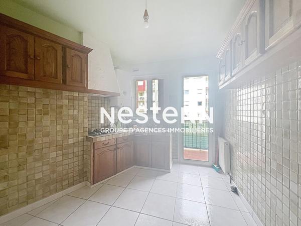 À vendre : Appartement spacieux de 4 pièces à Perpignan, secteur Kennedy, balcons et place de parking.