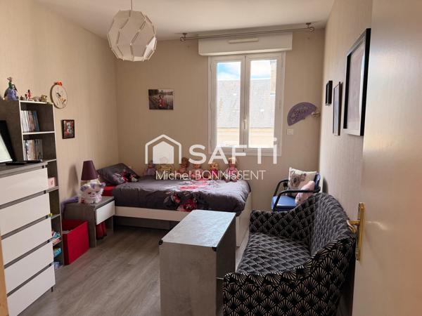 Appartement avec ascenseur et garage plein centre ville .
