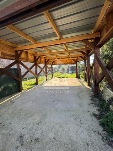 LA NEUVILLE TERRAIN VIABILISE AVEC GRAND CARPORT