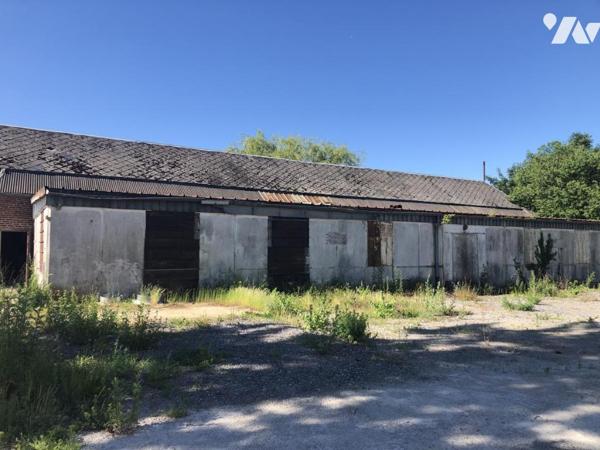 ENSEMBLE IMMOBILIER composé de deux bâtiments et un terrain constructible