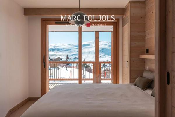 Appartement 2 Chambres + Cabine à l’Alpe d’Huez – Vue Panoramique et Services Haut de Gamme.