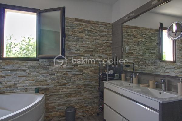 Niché sur les hauteurs d’Alès, le bien bénéficie d’une situation et d’un cadre de vie privilégié tout en profitant d’une vue panoramique exceptionnelle.
Cette villa contemporaine de 165 m², pensée et conçue pour un confort optimal allie le mariage parfait entre design moderne et prestations haut de gamme.
L’accès à la villa se réalise par un superbe escalier extérieur en pierres de Bourgogne.
L’intérieur de la maison offre une cuisine ouverte sur une pièce de vie de belle dimension s’ouvrant sur une magnifique terrasse.
Les baies vitrées panoramiques permettent à la lumière naturelle d’être présente créant ainsi une atmosphère chaleureuse.
Le rez-de-chaussée offre également trois chambres, une salle de bain et une buanderie.
L’étage accueille un espace parental de 40 m² avec une salle d’eau disposant en plus d’une baignoire, créant un véritable espace de détente, une chambre et son dressing avec sa petite terrasse privative et son sublime panorama.
A l’extérieur, vous disposerez d’un espace à vivre d’environ 450 m² et sa généreuse terrasse, son jacuzzi, sa piscine avec sa plage et sa cuisine d’été pourvue d’une pergola Bio climatique.
Des panneaux photovoltaïques pour des économies d'énergie, un grand garage, une alarme (avec abonnement) complètent le bien.
Charme, simplicité et cohérence font de ce bien un véritable petit paradis 
Alliant sérénité et convivialité, il est idéal pour une famille ou un couple aimant recevoir.
Votre conseiller immobilier sur le bassin alésien, Lionel Rodier O6.81.447.157, l.rodier@bskimmobilier.com