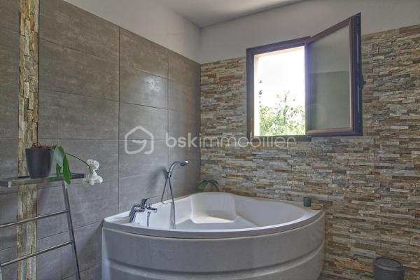 Niché sur les hauteurs d’Alès, le bien bénéficie d’une situation et d’un cadre de vie privilégié tout en profitant d’une vue panoramique exceptionnelle.
Cette villa contemporaine de 165 m², pensée et conçue pour un confort optimal allie le mariage parfait entre design moderne et prestations haut de gamme.
L’accès à la villa se réalise par un superbe escalier extérieur en pierres de Bourgogne.
L’intérieur de la maison offre une cuisine ouverte sur une pièce de vie de belle dimension s’ouvrant sur une magnifique terrasse.
Les baies vitrées panoramiques permettent à la lumière naturelle d’être présente créant ainsi une atmosphère chaleureuse.
Le rez-de-chaussée offre également trois chambres, une salle de bain et une buanderie.
L’étage accueille un espace parental de 40 m² avec une salle d’eau disposant en plus d’une baignoire, créant un véritable espace de détente, une chambre et son dressing avec sa petite terrasse privative et son sublime panorama.
A l’extérieur, vous disposerez d’un espace à vivre d’environ 450 m² et sa généreuse terrasse, son jacuzzi, sa piscine avec sa plage et sa cuisine d’été pourvue d’une pergola Bio climatique.
Des panneaux photovoltaïques pour des économies d'énergie, un grand garage, une alarme (avec abonnement) complètent le bien.
Charme, simplicité et cohérence font de ce bien un véritable petit paradis 
Alliant sérénité et convivialité, il est idéal pour une famille ou un couple aimant recevoir.
Votre conseiller immobilier sur le bassin alésien, Lionel Rodier O6.81.447.157, l.rodier@bskimmobilier.com
