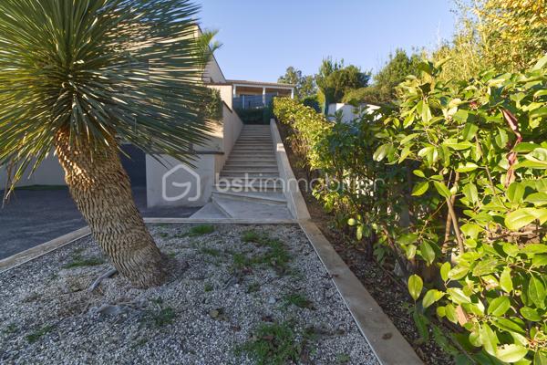 Niché sur les hauteurs d’Alès, le bien bénéficie d’une situation et d’un cadre de vie privilégié tout en profitant d’une vue panoramique exceptionnelle.
Cette villa contemporaine de 165 m², pensée et conçue pour un confort optimal allie le mariage parfait entre design moderne et prestations haut de gamme.
L’accès à la villa se réalise par un superbe escalier extérieur en pierres de Bourgogne.
L’intérieur de la maison offre une cuisine ouverte sur une pièce de vie de belle dimension s’ouvrant sur une magnifique terrasse.
Les baies vitrées panoramiques permettent à la lumière naturelle d’être présente créant ainsi une atmosphère chaleureuse.
Le rez-de-chaussée offre également trois chambres, une salle de bain et une buanderie.
L’étage accueille un espace parental de 40 m² avec une salle d’eau disposant en plus d’une baignoire, créant un véritable espace de détente, une chambre et son dressing avec sa petite terrasse privative et son sublime panorama.
A l’extérieur, vous disposerez d’un espace à vivre d’environ 450 m² et sa généreuse terrasse, son jacuzzi, sa piscine avec sa plage et sa cuisine d’été pourvue d’une pergola Bio climatique.
Des panneaux photovoltaïques pour des économies d'énergie, un grand garage, une alarme (avec abonnement) complètent le bien.
Charme, simplicité et cohérence font de ce bien un véritable petit paradis 
Alliant sérénité et convivialité, il est idéal pour une famille ou un couple aimant recevoir.
Votre conseiller immobilier sur le bassin alésien, Lionel Rodier O6.81.447.157, l.rodier@bskimmobilier.com