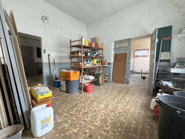 Maison de village de 130 m² avec garage, atelier indépendant et jardin paysager